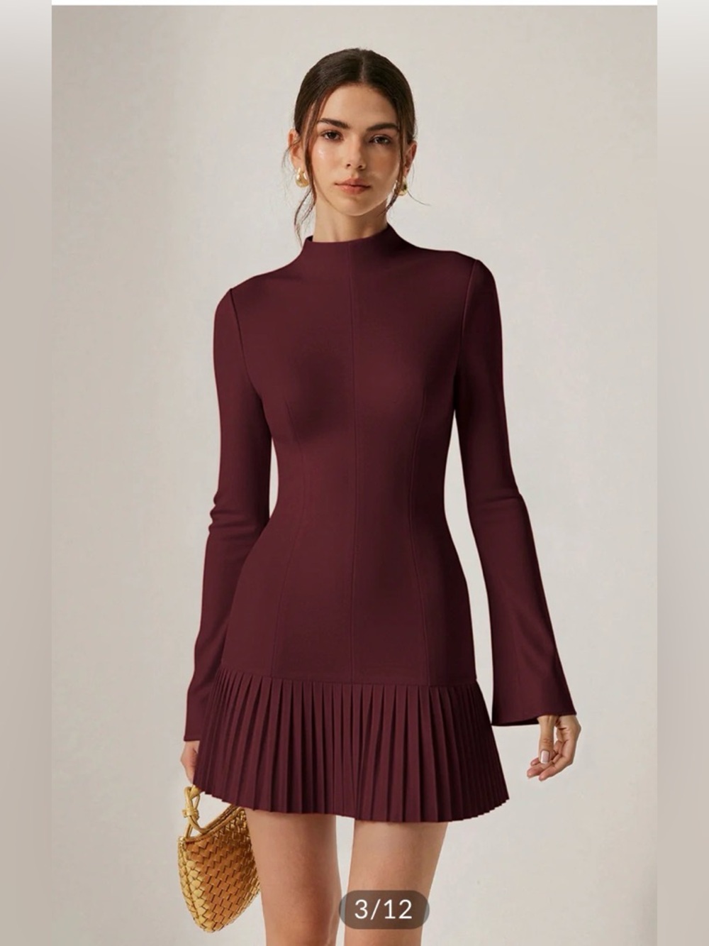 Flirty fitted mock neck with pleated hem